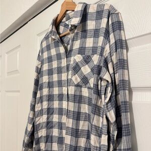 Plaid women’s blue and white button down shirt.